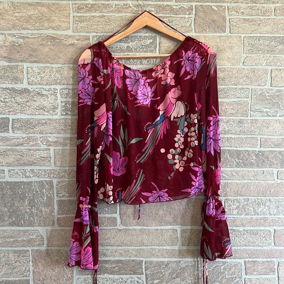 26. Free People Of Paradise Floral Bell Sleeve Blouse - Picture 6 of 6